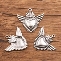 Silver winged heart charm for jewelry DIY, showing front and back views on wood - 27B2-3 Wings Sacred Heart
