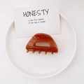 Minimalist brown amber patterned acetate hair claw clip on a white display plate - Dark Coffee