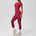 Detail of high-waist burgundy yoga set featuring side pockets and brushed fabric - Carmine