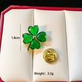 Detail of green clover brooch with gold setting and butterfly clasp in a jewelry box - Green Clover (C292)