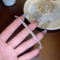 Silver tennis bracelet with rectangular step-cut zircons on woman's hand - Silver Square Diamond Bracelet (GA3416)