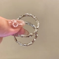 Detailed close-up of silver hoop earrings with irregular lava texture and crinkle design - Irregular Silver Hoop (42#)