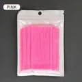 Pink disposable micro eyelash brushes in a bulk pack for makeup application - Pink