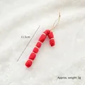 Handmade red wool felt candy cane Christmas ornament with twine loop, 11.5cm long - Red Circle Cane