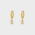 Detailed close-up of a gold-plated hoop earring featuring a sparkling zircon-set S pendant - S