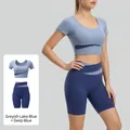 Grijsblauwe crop top en walvisblauwe high-waist yogaset met kleurvlakken - S / Boven- En Onderstuk / Meerblauw + Walvisblauw