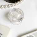 Transparent round crystal ball phone socket with white cloud-like texture filling - White
