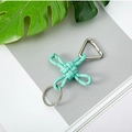 Mint green braided paracord keychain with silver ring and carabiner on grey magazine - Camo Light Green
