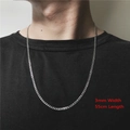 Close-up van 3 mm zilveren roestvrijstalen schakelketting gedragen op een zwart shirt - ZJ5139-3mm 55cm Zilveren Ketting