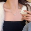 Detail of silver titanium steel necklace with star pendants on model neck - Multiple Star Pendant Style (X1199) / Silver/Pentagram Decor