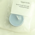 Light blue smokeless tealight candle in clear packaging with a white decorative card - Haze Blue (Azure)