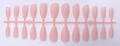 Macro detail of 24 pieces matte pink almond press-on nails on a plastic holder - Matte Pink (SDM-08)