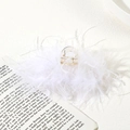 Detail shot of a transparent plastic hair claw clip with elegant white ostrich feathers - 9.5cm White Ostrich Feather Claw Clip