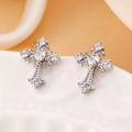 Close-up of silver cross stud earring with heart-shaped zircon and micro-pave crystals - White Gold Heart Main Stone Cross Stud