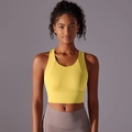 Close-up of bright yellow high-impact sports bra with racerback design and matte texture - Light Yellow