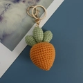 Handmade crochet carrot keychain with orange yarn and golden metal clasp accessory - Orange