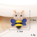 Detail view of colorful bee alloy charm with dimensions 2.8cm by 2.5cm and 6.8g weight - Gold/Blue Bee