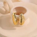 Golden titanium steel earrings with white pearl detail in a ribbed oval design - Gold Spiral Pearl Studs
