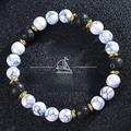White turquoise and volcanic stone beaded bracelet with dream charm on black background - Dream Style