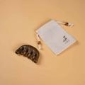 Dark brown sandalwood scalp massage comb with beige linen floral storage pouch - Golden Silk Sandalwood - With Cloth Bag