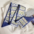 Blue geometric pattern skinny silk scarf tied as a soft hair ribbon for women - Colorful Wave Graphics
