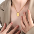 Luxurious gold square pendant necklace featuring embossed letter P on a boxy metal charm - Letter P Style (P1506-P)