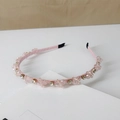 Macro detail of hand-stitched pink crystals and sparkling rhinestones on fabric headband - Style SJ007 / Matte Pink