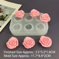 Detailed view of 6-cavity rose silicone mold with finished pink flower resin crafts - 6 Cavities Rose 3.3CM / Translucent