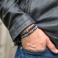 Men's distance bracelet set with black lava stone and blue marbled beads on wrist - Blue Weathered + Lava