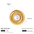 Detailed macro of 26mm gold hammered ring with 12mm white pearl inlay on white background - Hammered Disc Style (NB-R24338)