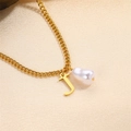 Elegant gold-tone initial J pendant necklace with baroque pearl on silky background - Letter J Necklace