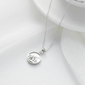 Silver stainless steel Mt. Fuji shell pendant necklace for women on white fabric - Mountain / Silver