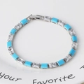 Zilveren tennisarmband met rechthoekige turkoois en zirkonia in een klauwzetting - Turquoise & Wit Zirkon Zilver