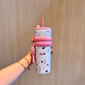 Pink and white stainless steel tumbler with tulip patterns and a carrying strap - UV Printed Pink