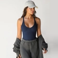 Deep blue ribbed knit tank top paired with grey tracksuit and beige baseball cap - Navy Blue