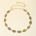 Detail of vintage ethnic gold metal waist chain with intricate engraved oval medallions - 19367 Antique Bronze