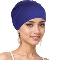 Close-up detail of blue turban hat fabric showing soft texture and elastic fit on model - One Size / Sapphire Blue