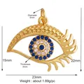 Golden Evil Eye charm pendant with blue and white zircons in a delicate finish - Light Green