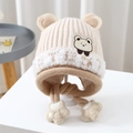 Detail showing the beige cable knit earflap hat with cute bear ears and plush trim - 2-8 Years / Beige