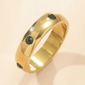 Minimalist 18K gold titanium steel ring featuring three round green gemstones on beige background - US 7 / Gold