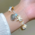 Set di bracciali bohémien multistrato con perle bianche e ciondolo a forma di stella - Perla Blu Lago Argento Antico (31 Argento Antico Blu Lago 3283)