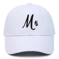 Close-up of white cotton baseball cap featuring black embroidered Mr. lettering on front - White MR