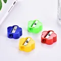 Mini flower-shaped pencil sharpeners in blue green yellow and red plastic - Flower Shaped