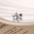 Pendiente de estrella en plata con circón azul claro y piedras de circonita clara - Azul Mar (Pieza Individual)