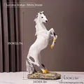 White resin jumping horse sculpture with golden hooves and dark rock textured base - Success White Horse / White