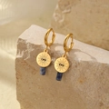 Golden sun and eye earrings with blue stone pendants on a natural stone base - Dark Blue Cylinder