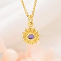 Detail of gold sunburst pendant necklace with a purple cubic zirconia eye inlay - K303 Purple Eye Pendant And Chain (ZYN-DMK303G)