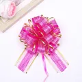 Pink ribbon pull bow with gold edges and bark texture for Christmas gift wrapping - Rose Red