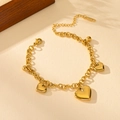 Elegant gold heart pendant bracelet in polished stainless steel with adjustable lobster clasp - Gold Three Hearts Two Bells