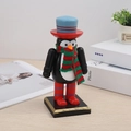 Detailed view of penguin-shaped wooden nutcracker with red and green knitted scarf - Christmas Penguin 16CM